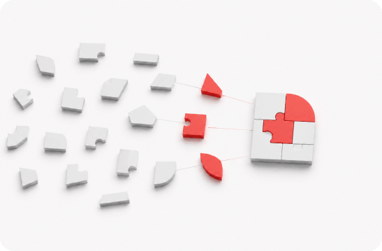 White and red 3D puzzle pieces coming together on a white surface to form a completed block